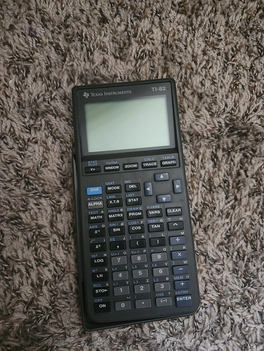Texas Instruments TI-82 Graphing Calculator in Black with Blue Keys